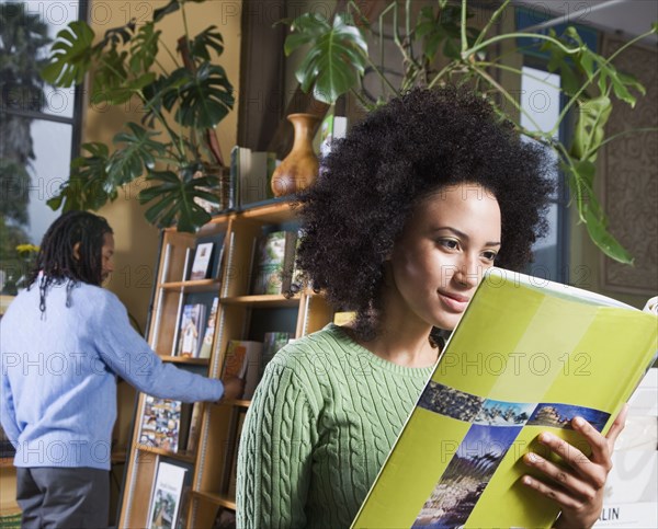 African woman reading book