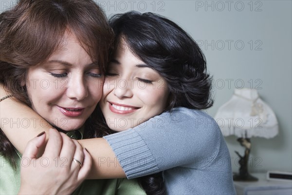 Young woman hugging mother