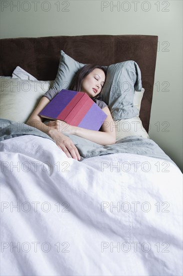 Woman sleeping with book