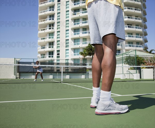 Couple playing tennis