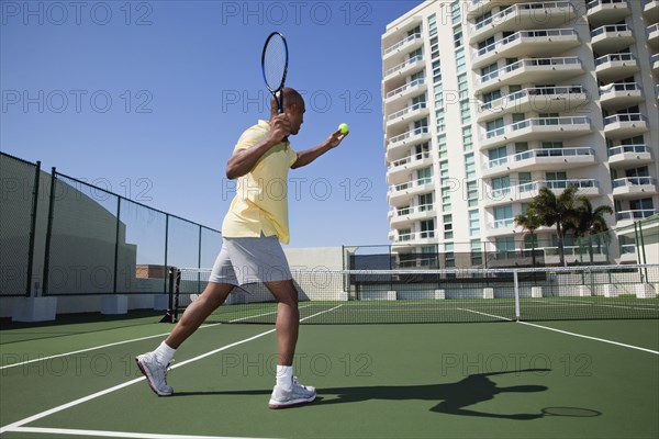 African man playing tennis