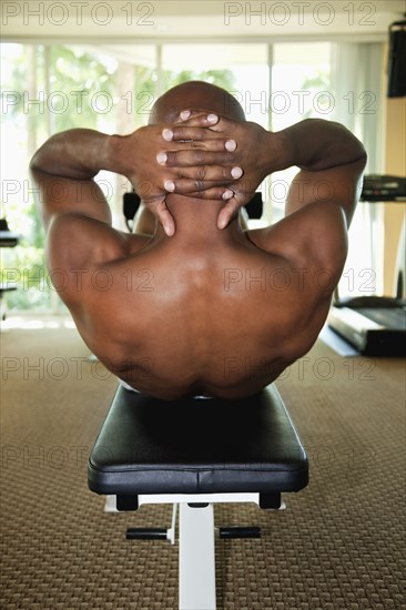 African man doing sit-ups