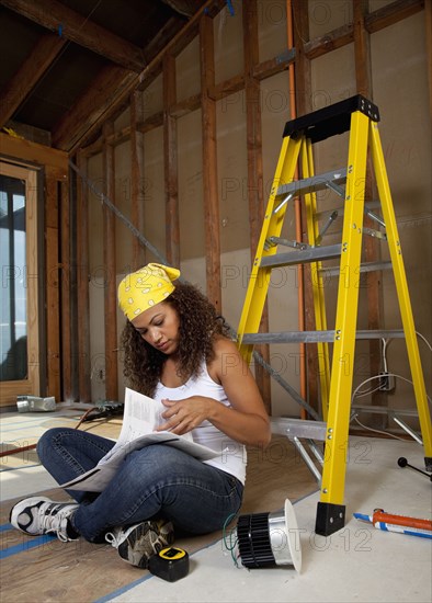 Hispanic woman working on construction site