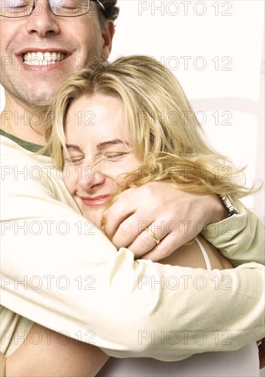 Caucasian couple hugging