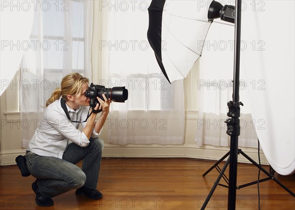 Caucasian photographer working in studio