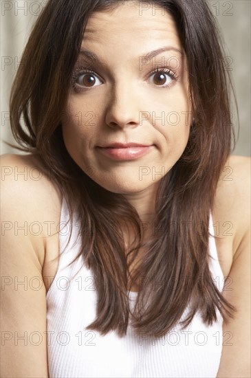 Mixed race woman shrugging