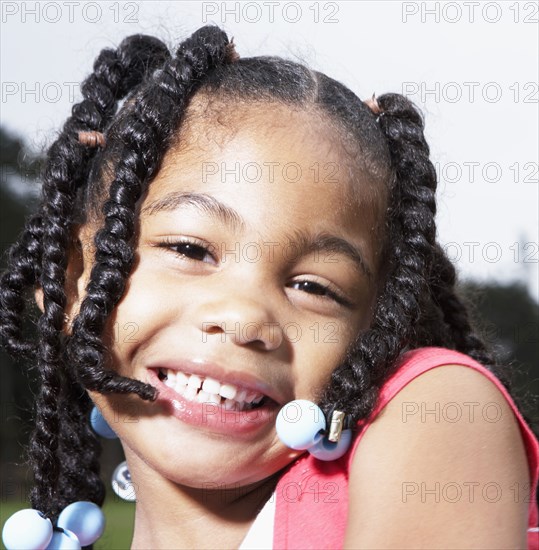 Mixed race girl smiling outdoors