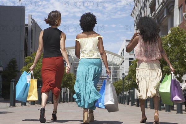 Women shopping together on city street