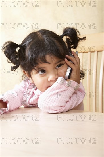 Hispanic girl talking on cell phone