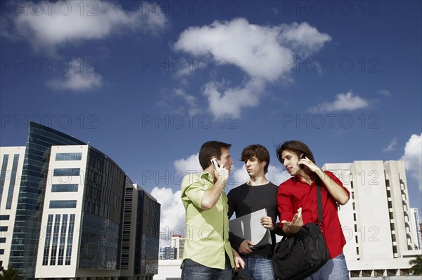 Men talking on city street