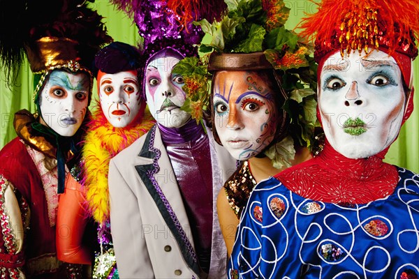 Clowns wearing theatrical makeup