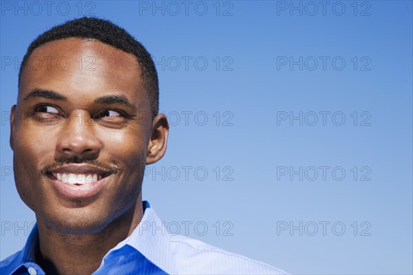 Mixed race man smiling