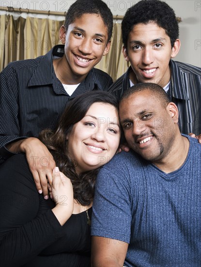 Parents and children smiling in living room