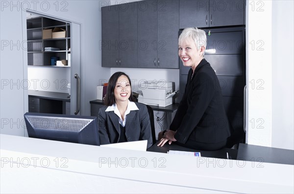 Businesswomen talking in office