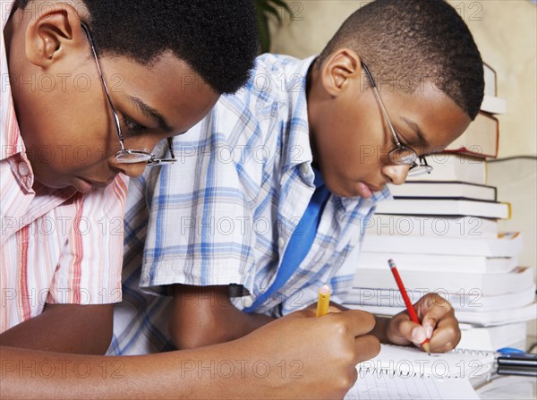 Mixed race boys doing their homework