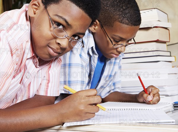 Mixed race boys doing their homework