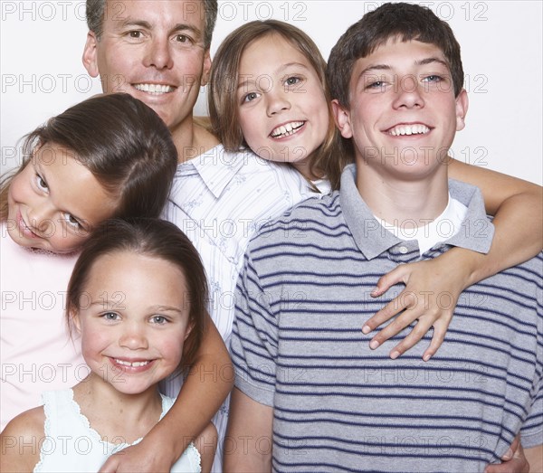 Father and children smiling together