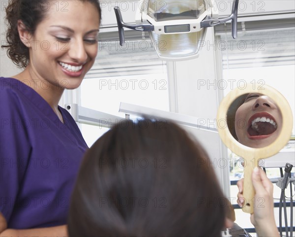 Dental nurse talking to patient