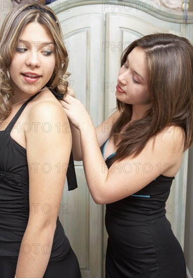 Teenage girls getting ready for dance together
