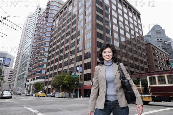 Chinese businesswoman standing on city street
