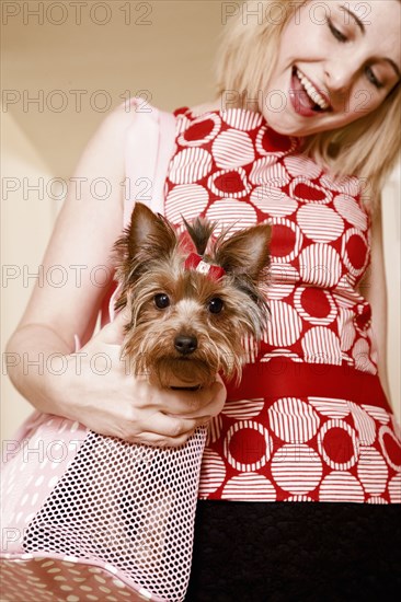 Caucasian woman petting dog