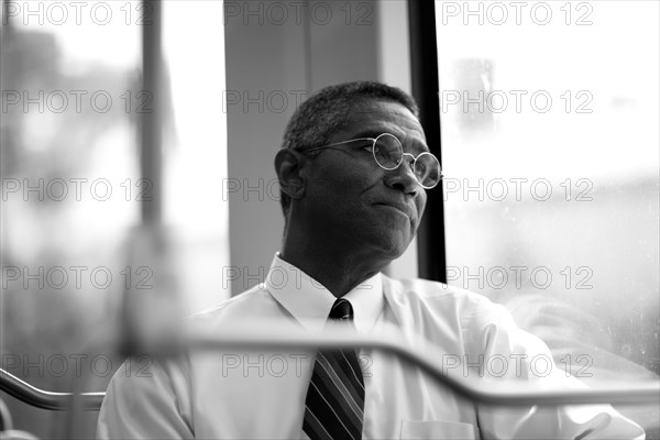 Mixed race businessman rising commuter train