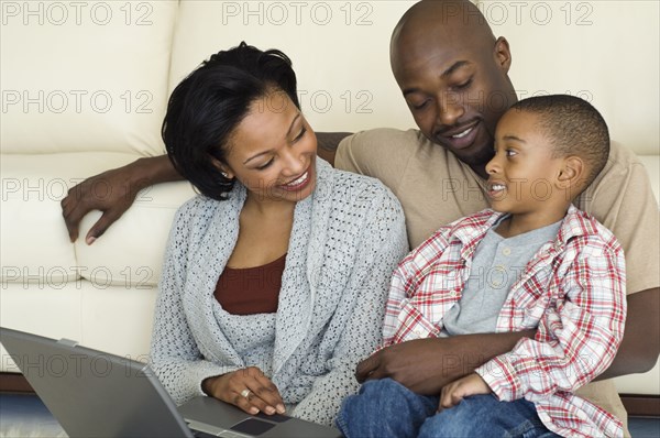 African family smiling at each other