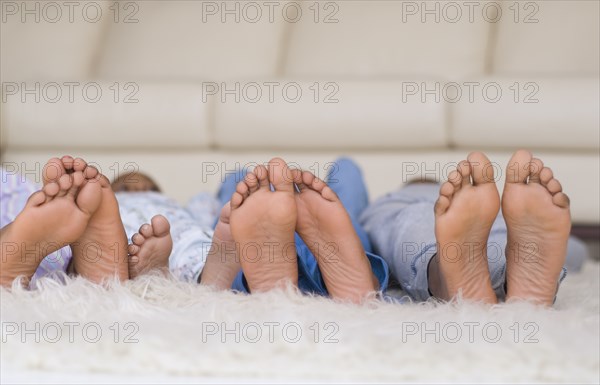 African family's bare feet in a row