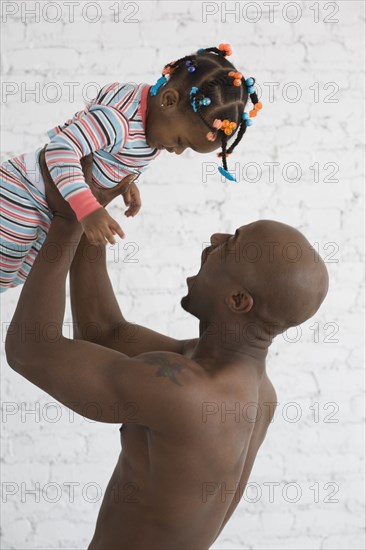African father playing with daughter