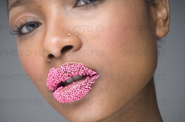 African woman with sprinkles on lips