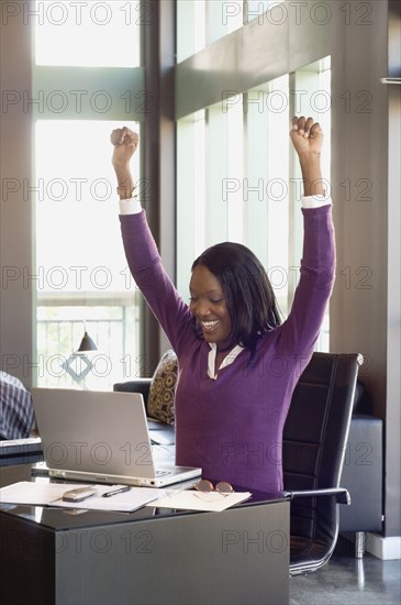 African businesswoman cheering