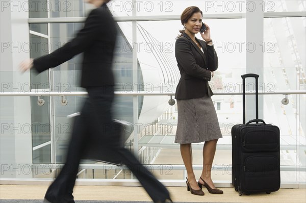 Hispanic businesswoman talking on cell phone