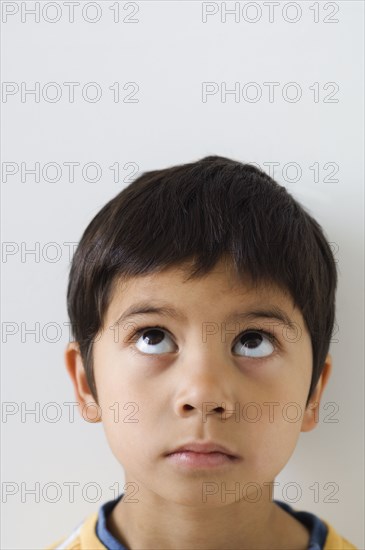 Asian boy looking up