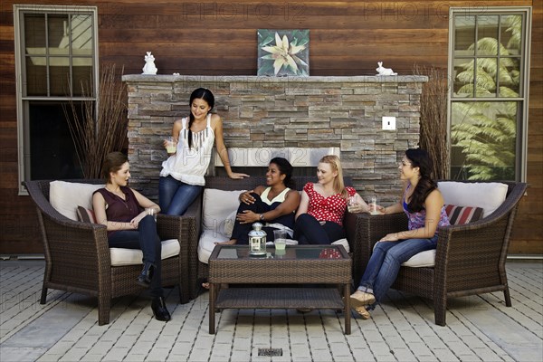 Women hanging out on patio living room