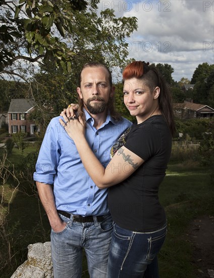 Caucasian couple hugging outdoors