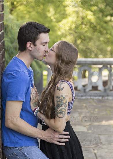 Caucasian couple kissing in park