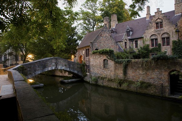 Quaint building and bridge over canal