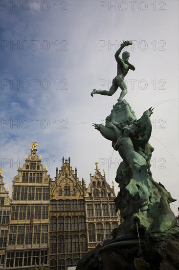 Ornate fountain with buildings in background