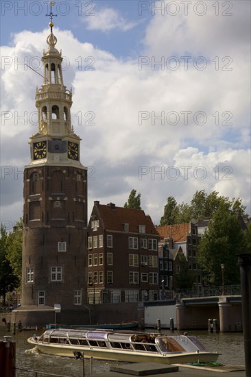 Historical landmark and tour boat in Amsterdam