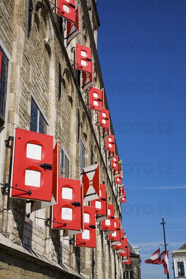 Red shutters on old building