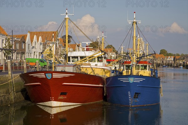 Fishing boats moored in harbor