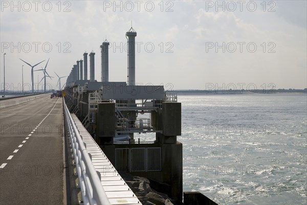 Wind turbines and dam across ocean