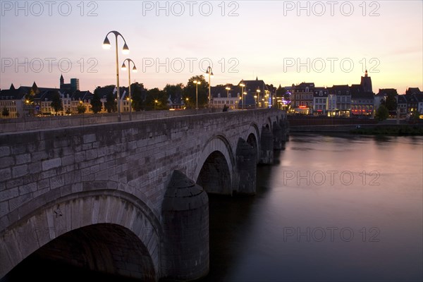 Dutch canal and bridge at sunset