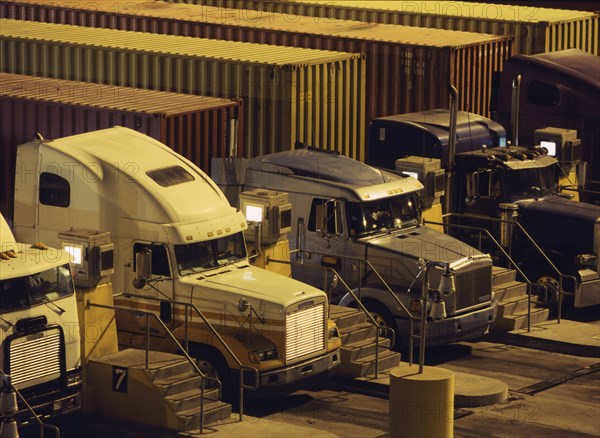 Semi-trucks parked in a row