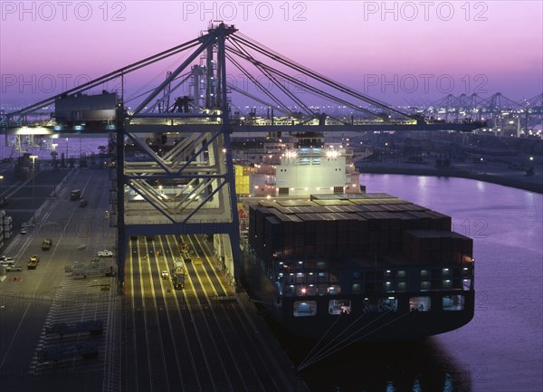 Cranes over container ship