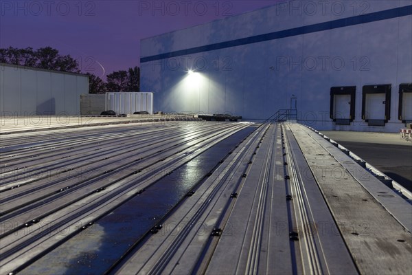 Flat bed truck trailers in parking lot