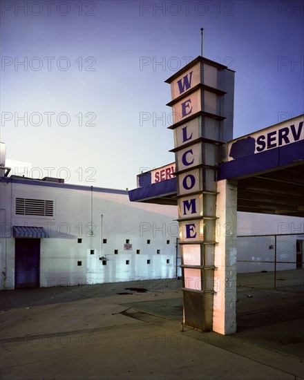 Empty drive-thru building at sunrise