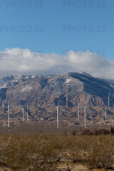 Wind turbines near mountain