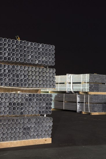 Pipes on pallets at night