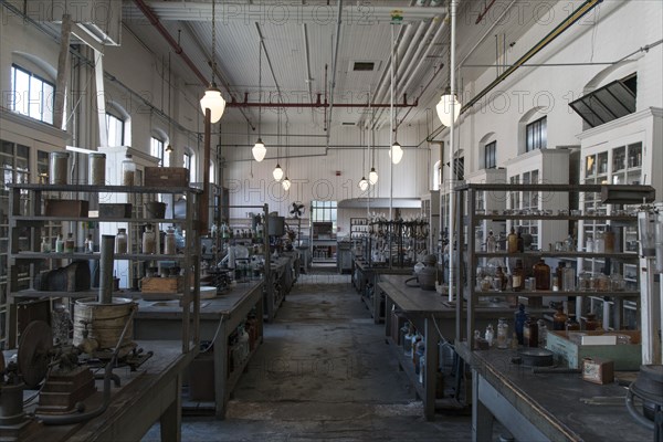 Tables and jars in empty old-fashioned factory